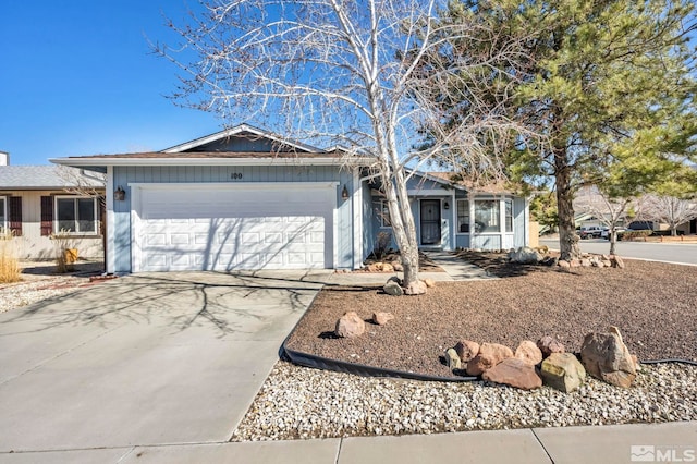 single story home featuring a garage and driveway