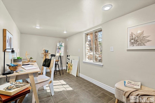 office area featuring recessed lighting, dark tile patterned floors, and baseboards