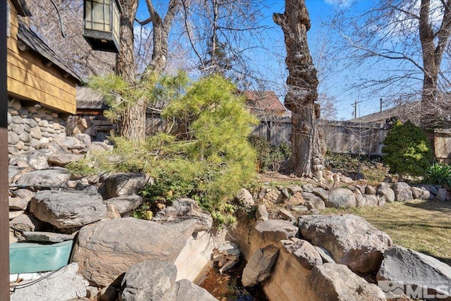 view of yard with fence