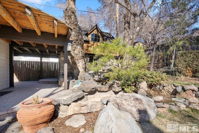 view of yard with a patio and fence