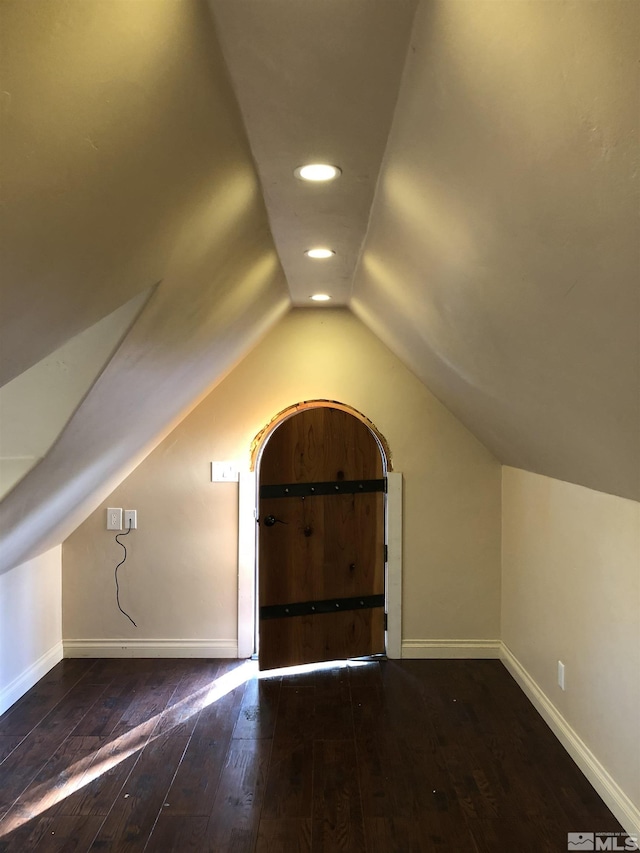 bonus room with lofted ceiling, recessed lighting, hardwood / wood-style flooring, and baseboards