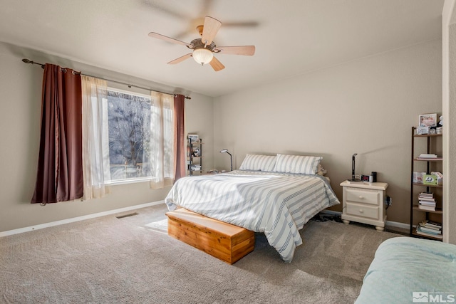 bedroom with a ceiling fan, baseboards, visible vents, and carpet flooring