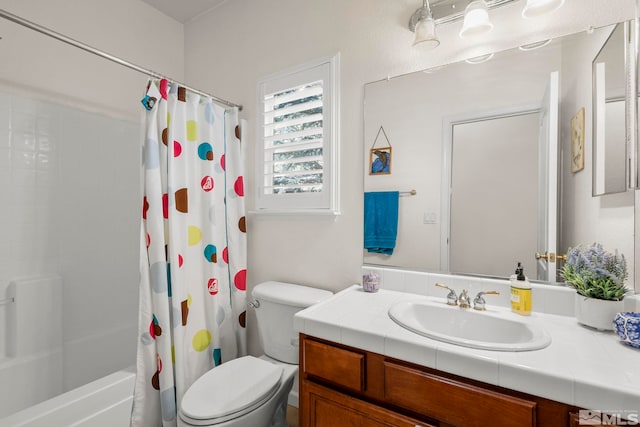 bathroom with shower / bath combo with shower curtain, vanity, and toilet