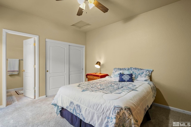 bedroom featuring attic access, a closet, carpet floors, and baseboards