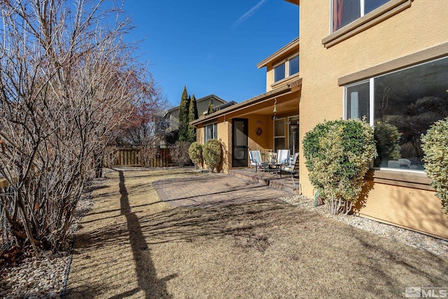 view of yard featuring a patio area and fence