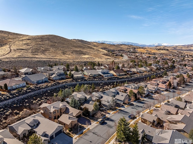 birds eye view of property featuring a mountain view and a residential view