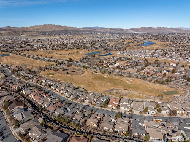 drone / aerial view featuring a residential view and a mountain view