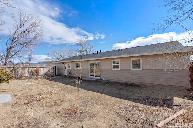 back of property featuring fence