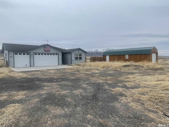 view of front of house featuring driveway and a garage