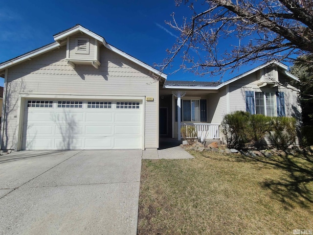 single story home with a front yard, covered porch, an attached garage, and concrete driveway