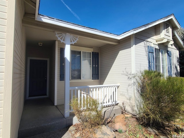 doorway to property with covered porch