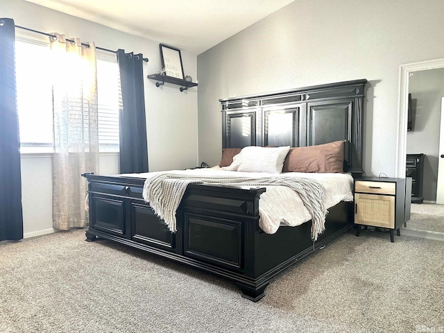 bedroom featuring light colored carpet