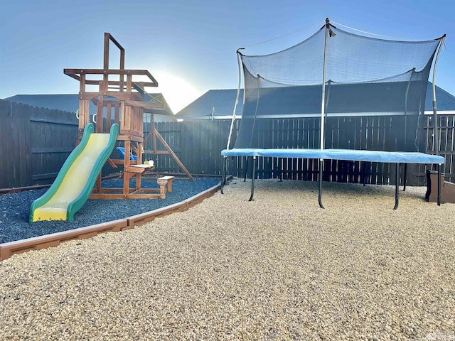 view of playground with a fenced backyard