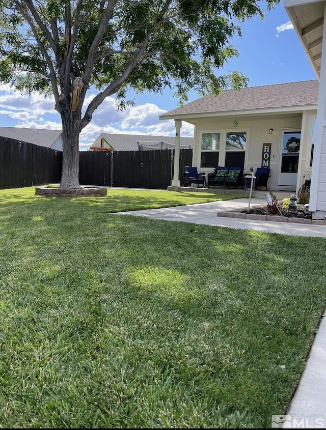 view of yard with a patio area and fence