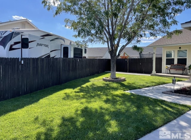 view of yard with a patio area and fence