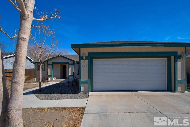 single story home with a garage and driveway