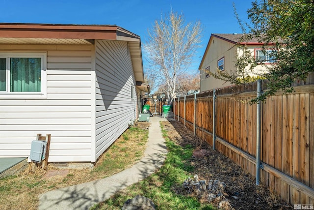 view of home's exterior with fence