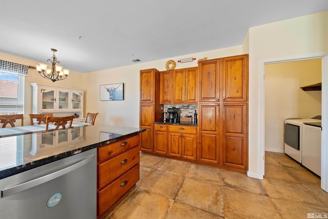 kitchen with washing machine and dryer, visible vents, brown cabinets, dishwasher, and decorative light fixtures