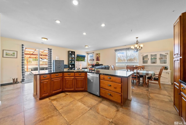 kitchen with brown cabinets, dark countertops, recessed lighting, an inviting chandelier, and dishwasher