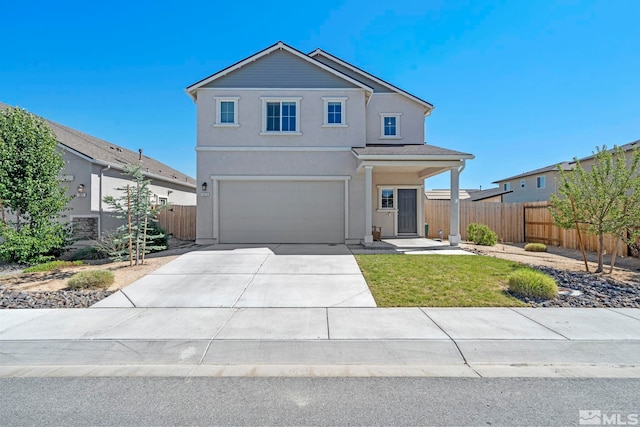 traditional home with a garage, driveway, fence, and stucco siding