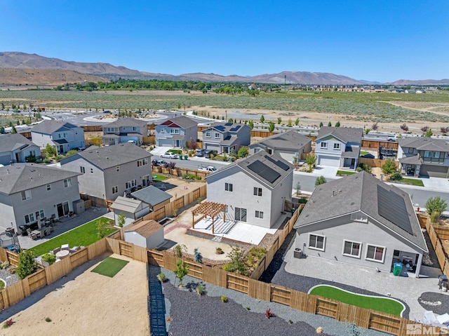 birds eye view of property featuring a mountain view and a residential view