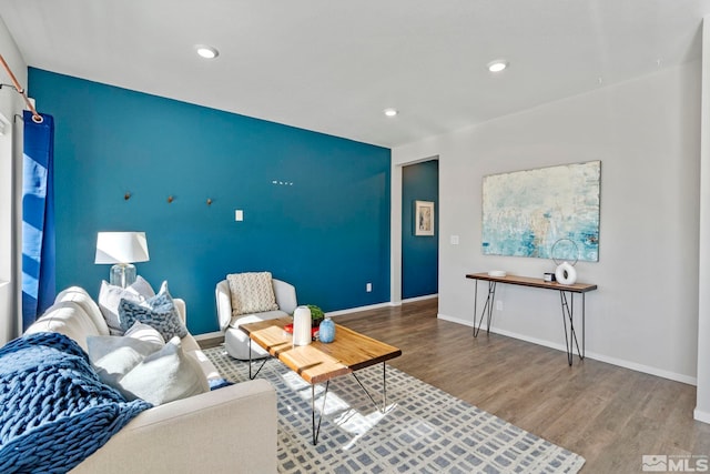 living room with recessed lighting, wood finished floors, and baseboards