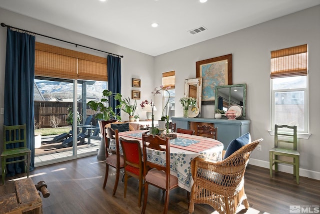 dining area with baseboards, visible vents, wood finished floors, and recessed lighting