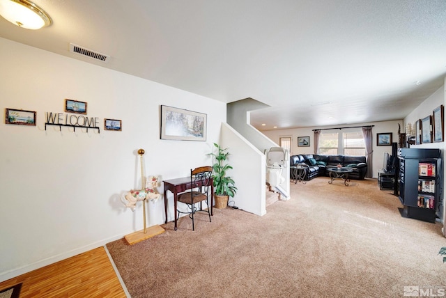 interior space with stairway, visible vents, and baseboards