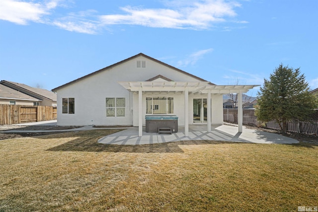 back of property with a patio, a pergola, a fenced backyard, and a hot tub