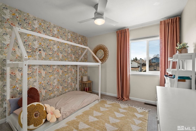 bedroom featuring ceiling fan, carpet floors, wallpapered walls, and baseboards