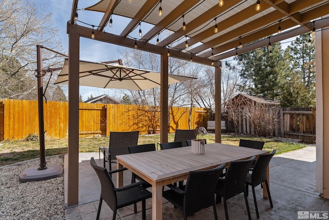 view of patio / terrace featuring outdoor dining area, a fenced backyard, and a pergola