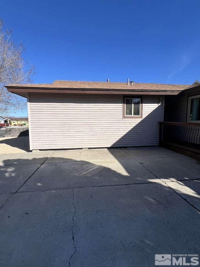 view of side of home featuring a patio area