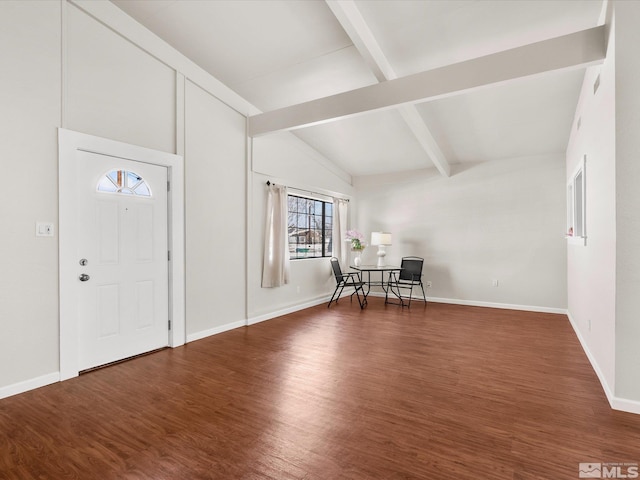 entryway with lofted ceiling with beams, baseboards, and wood finished floors