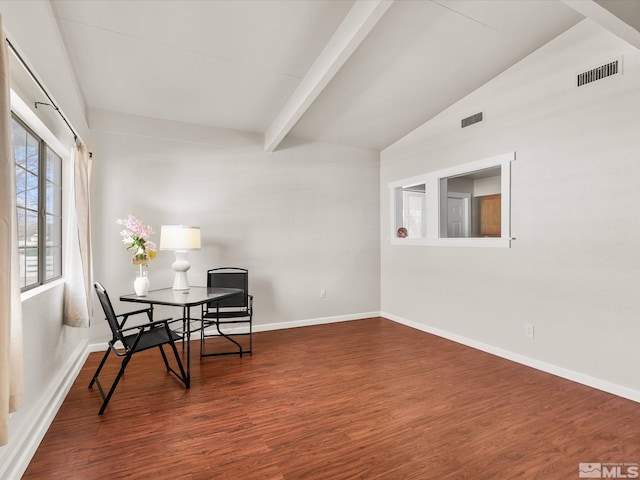 interior space with vaulted ceiling with beams, baseboards, visible vents, and wood finished floors