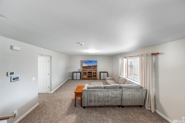 living room with carpet and baseboards