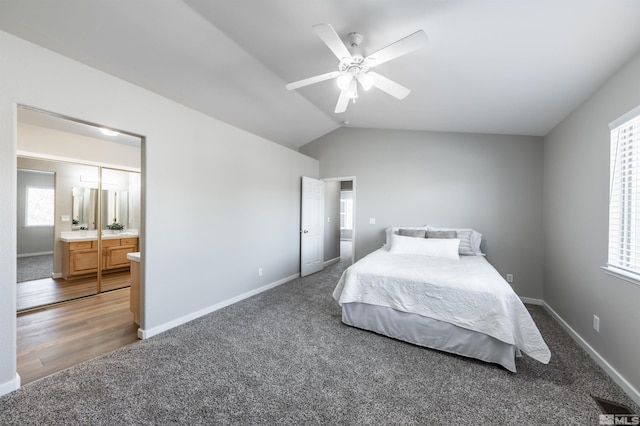 bedroom with baseboards, a ceiling fan, wood finished floors, vaulted ceiling, and carpet floors