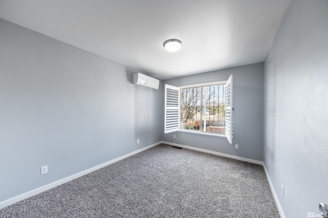 carpeted empty room featuring a wall mounted air conditioner, visible vents, and baseboards