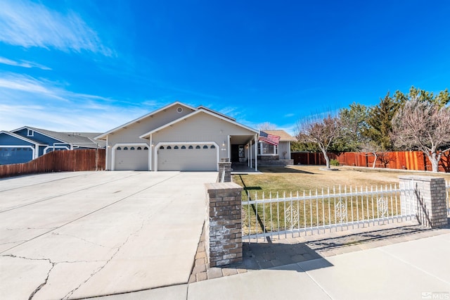 single story home with driveway, a fenced front yard, and an attached garage