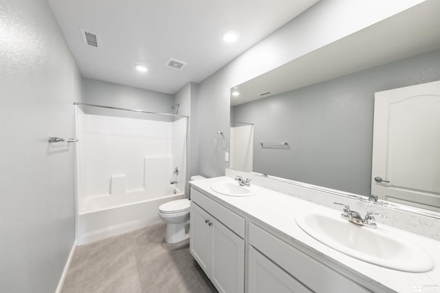 full bathroom with visible vents, a sink, toilet, and double vanity