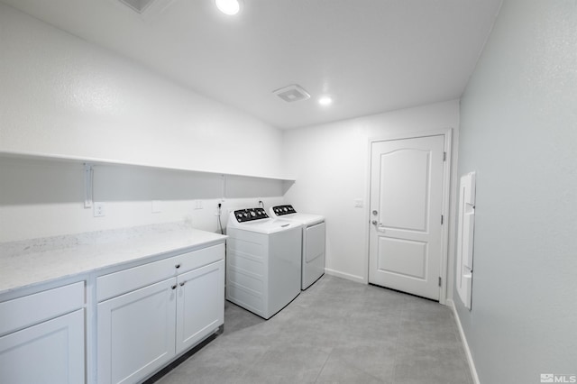 laundry area featuring washer and dryer, cabinet space, baseboards, and recessed lighting