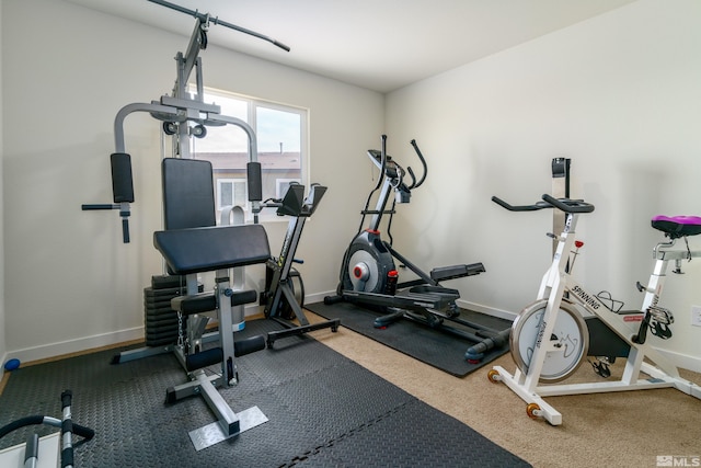 exercise room with baseboards