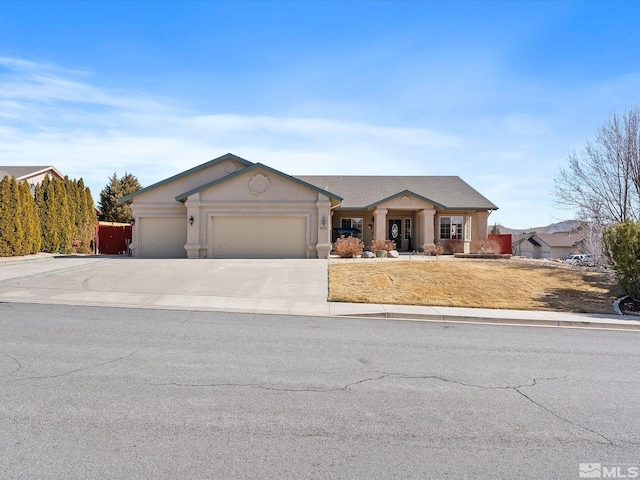 view of front of house featuring an attached garage and concrete driveway