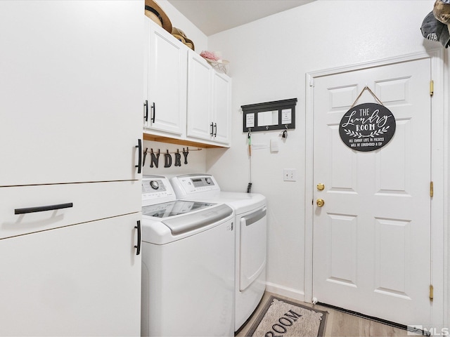 washroom with baseboards, cabinet space, light wood finished floors, and separate washer and dryer