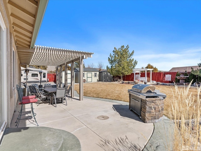 view of patio featuring outdoor dining area, a fenced backyard, a storage shed, an outdoor structure, and a pergola