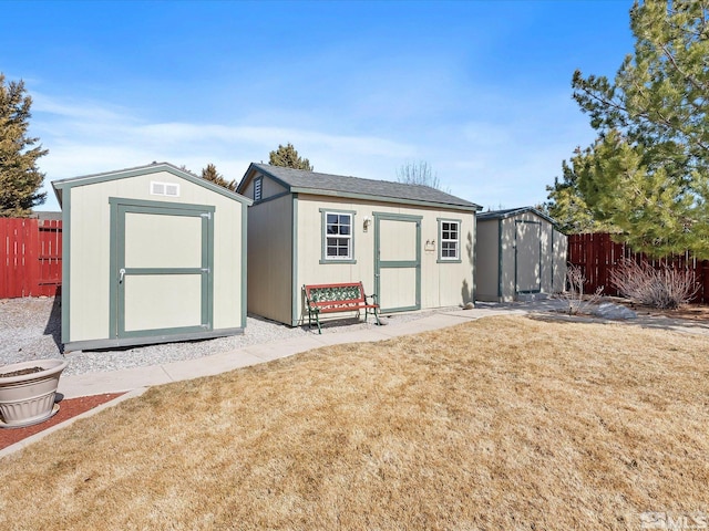 view of shed featuring fence