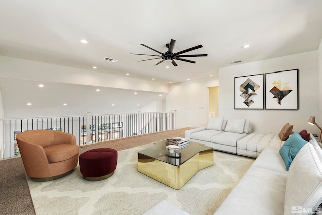 living room featuring visible vents, carpet flooring, and recessed lighting