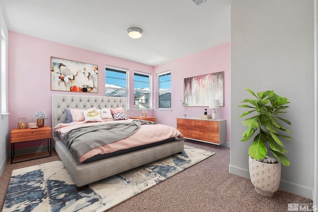 bedroom featuring carpet flooring, visible vents, and baseboards