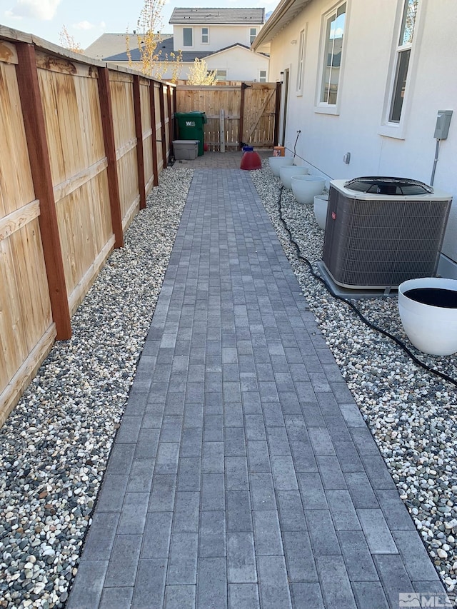 view of patio / terrace with a fenced backyard and central AC