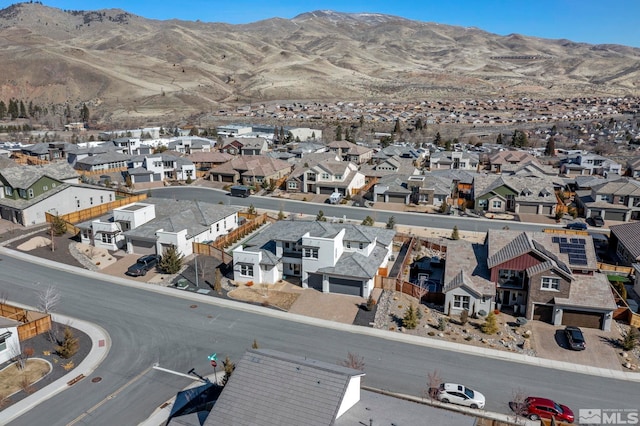 birds eye view of property with a mountain view and a residential view