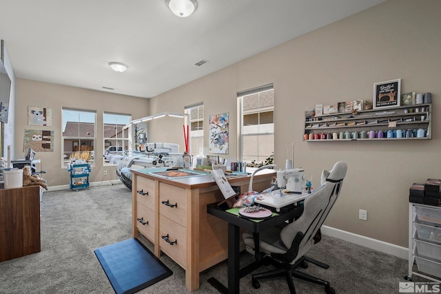 home office with carpet flooring, visible vents, and baseboards